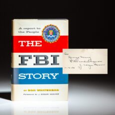 First edition of The FBI Story: A Report to the People by Don Whitehead, inscribed by FBI Director J. Edgar Hoover to the founder of the AFL-CIO, George Meany.