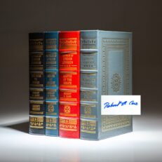 Four volumes of The Years of Lyndon Johnson from The Easton Press, signed in Volume I by historian Robert A. Caro.