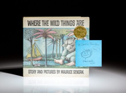 Early edition of Where the Wild Things Are by Maurice Sendak, signed by the author with a "Wild Thing" illustration.