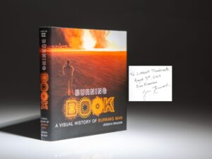 Signed first edition of Burning Book: A Visual History of Burning Man by Jessica Bruder, inscribed to notable book collector Cuthbert C. Thambimuttu.