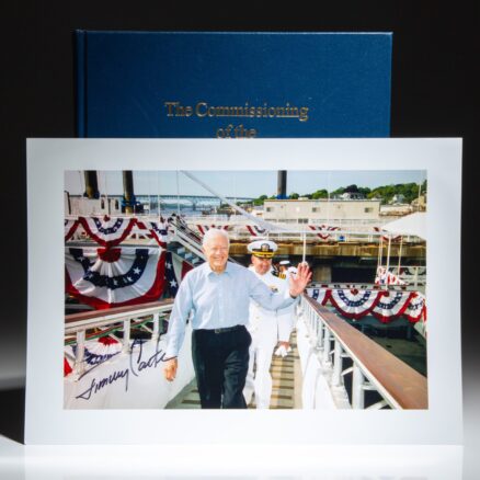 First edition of The Commissioning of the USS Jimmy Carter (SSN-23), with a signed photograph of President Jimmy Carter.