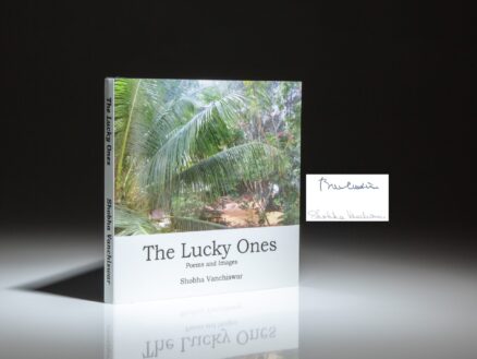 First edition of The Lucky Ones: Poems and Images by Shobha Vanchiswar, signed by the author and President Bill Clinton.