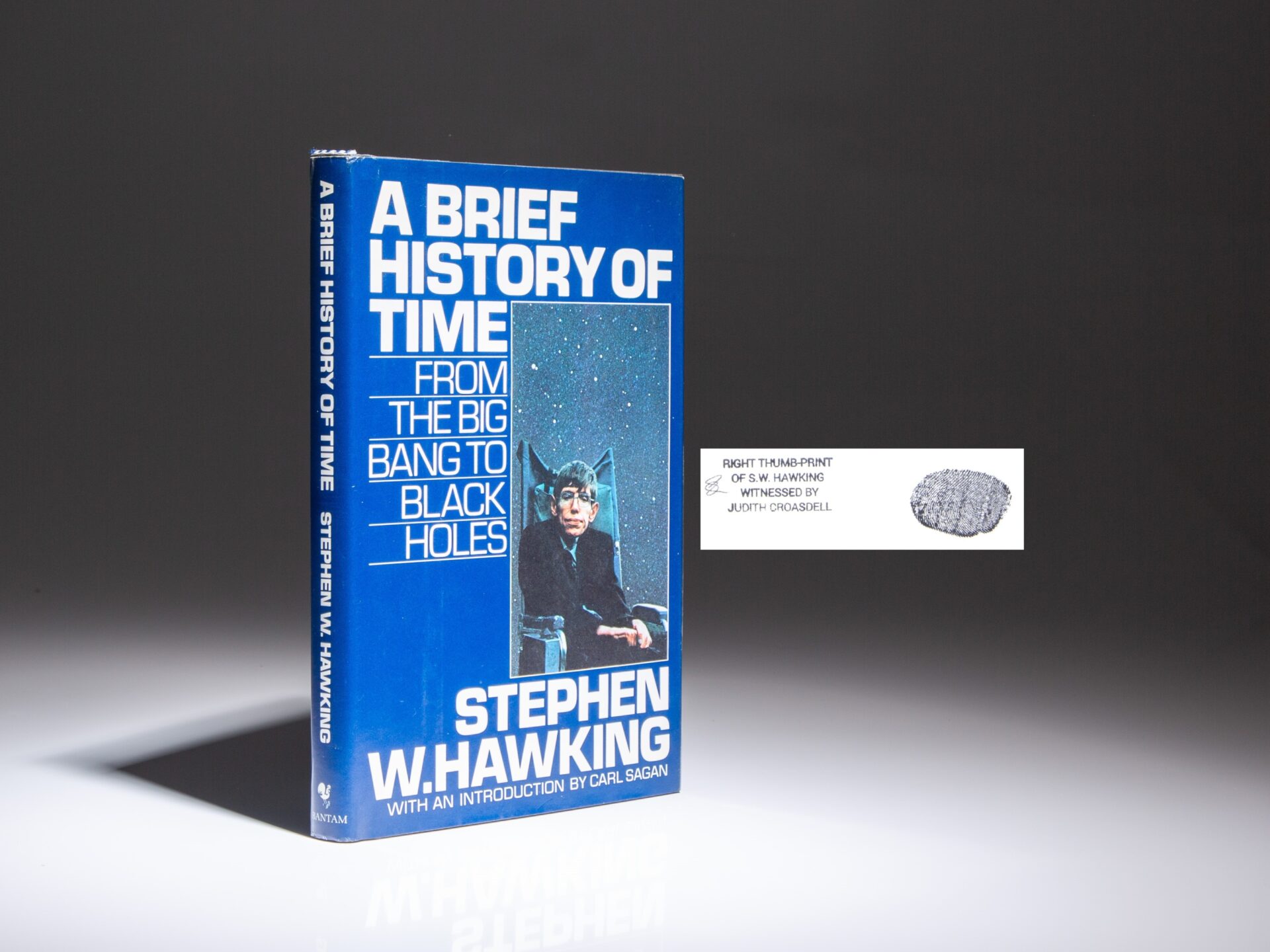 A Brief History of Time by Stephen Hawking, with his thumbprint on the title page and an annotation by his long-time personal assistant, Judith Croasdell.