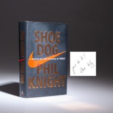 The first edition of Shoe Dog: A Memoir by the Creator of Nike, Phil Knight, inscribed "Just Do It!"