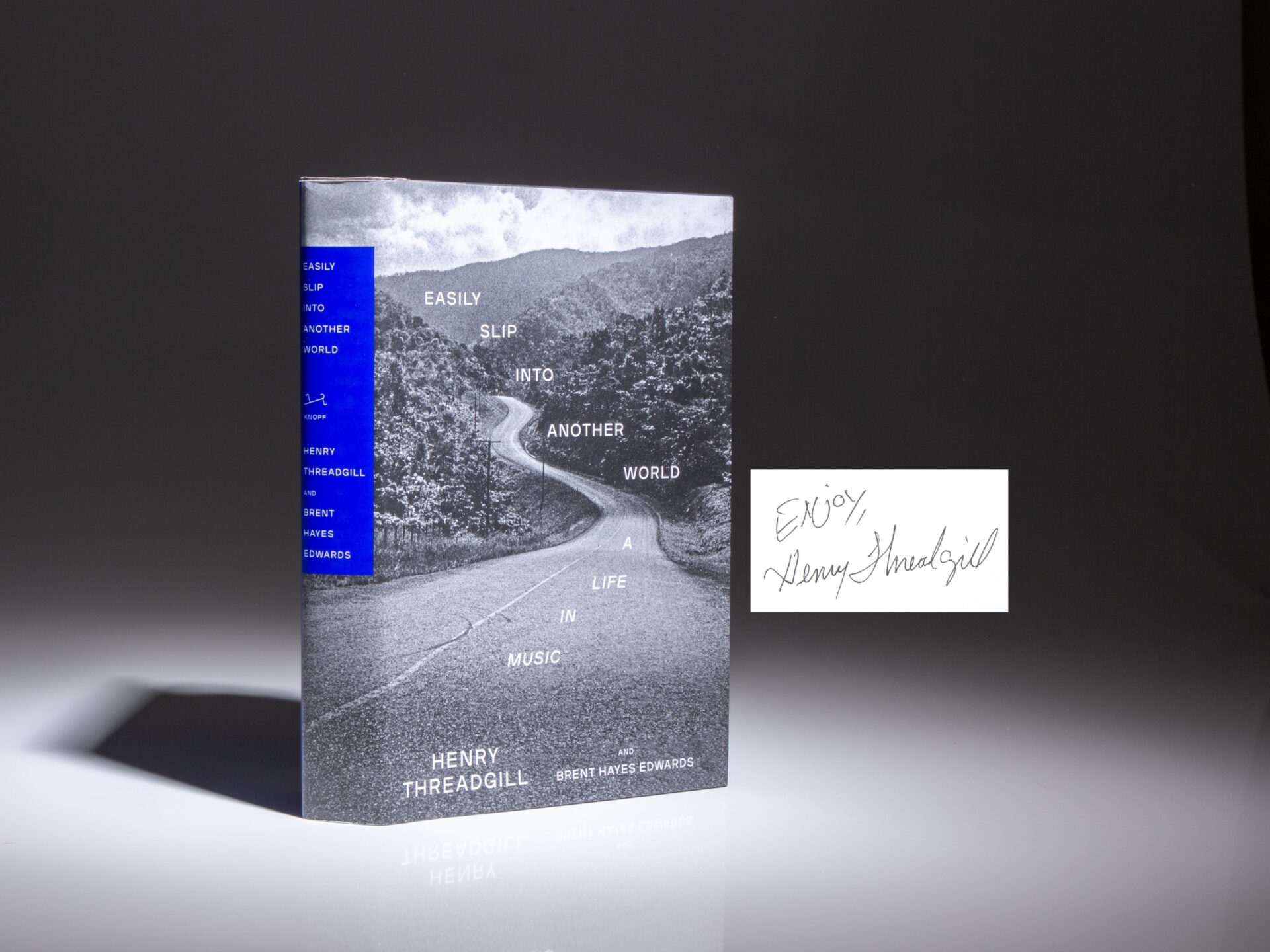 Signed first edition of Easily Slip Into Another World: A Life in Music by Henry Threadgill.