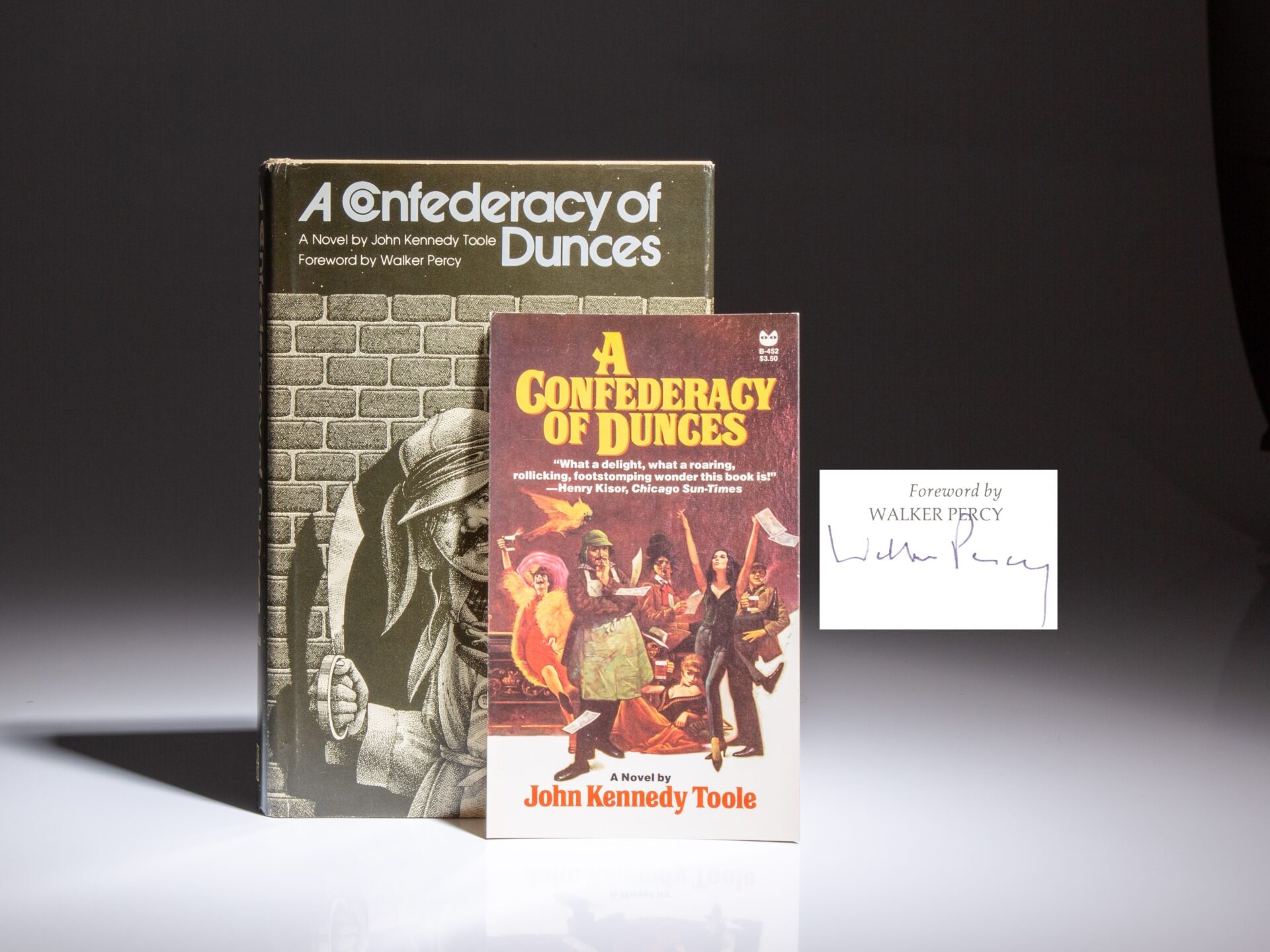 First edition of A Confederacy of Dunces by John Kennedy Toole, in the publisher's first state dust jacket. This copy is signed by Walker Percy.