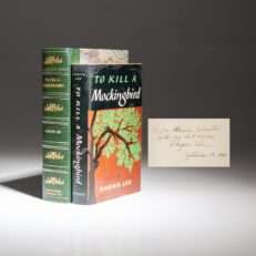 First edition, first printing of To Kill A Mockingbird by Harper Lee, with a tipped-in signature from September 1960. In the publisher's first issue dust jacket.