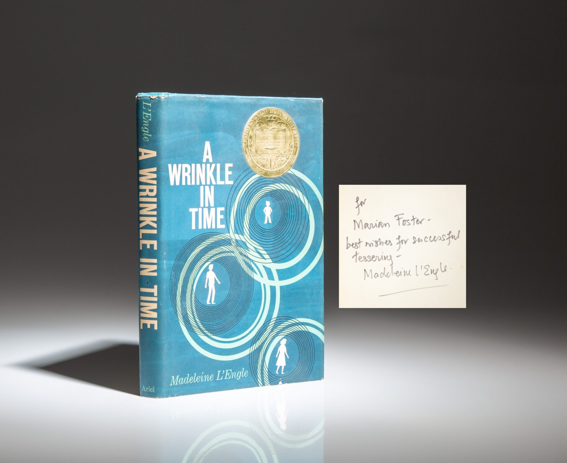 Signed copy of A Wrinkle In Time by Madeleine L'Engle, with an inscription by the author referencing "tessering."