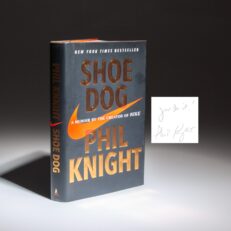 Shoe Dog: A Memoir by the Creator of Nike, Phil Knight, inscribed "Just Do It!"