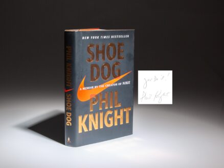 Shoe Dog: A Memoir by the Creator of Nike, Phil Knight, inscribed "Just Do It!"