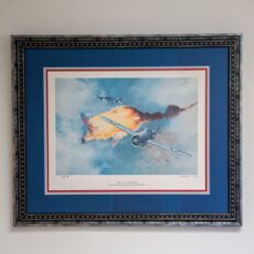 The limited edition of "Victory Over Guadalcanal" by Ted Wilbur, from a limited edition of 750 prints, individually numbered and signed by the artist. Additional signature of General Joseph J. Foss on the matte.