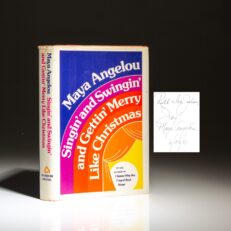Signed first edition of Singin' and Swingin' and Gettin' Merry Like Christmas by Maya Angelou.
