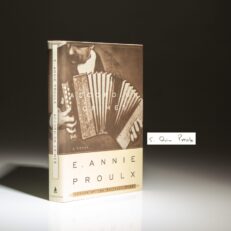 The first edition of Accordion Crimes, signed and dated by Edna Ann Proulx.