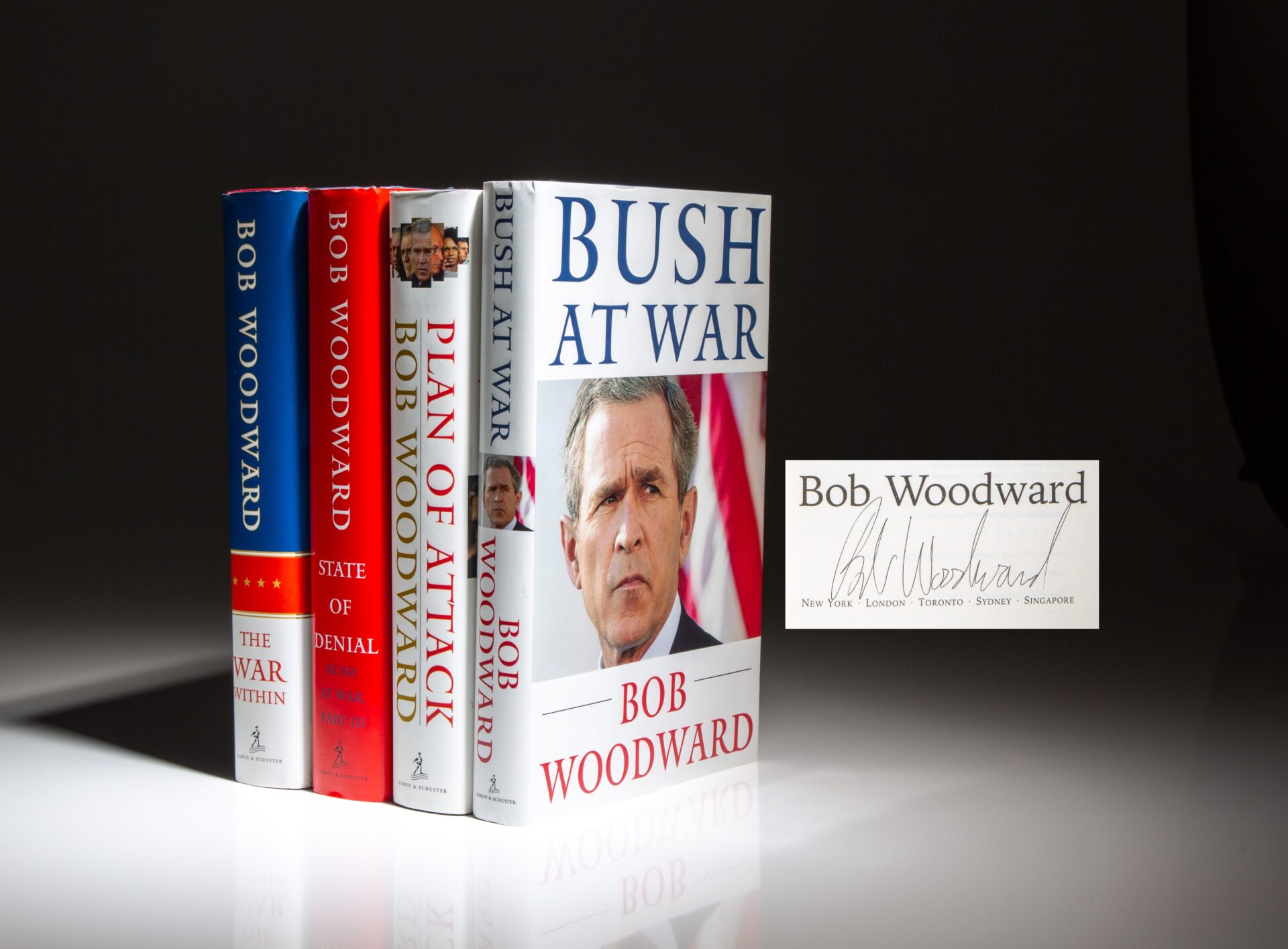 The four-volume Bush At War Series by Washington Post journalist Bob Woodward, all first printings and signed by the author.