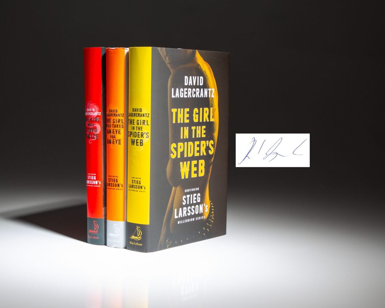 Signed first editions of the second "Millennium" trilogy by David Lagercrantz. This set includes The Girl in the Spider's Web, The Girl Who Takes an Eye for an Eye, and The Girl Who Lived Twice.