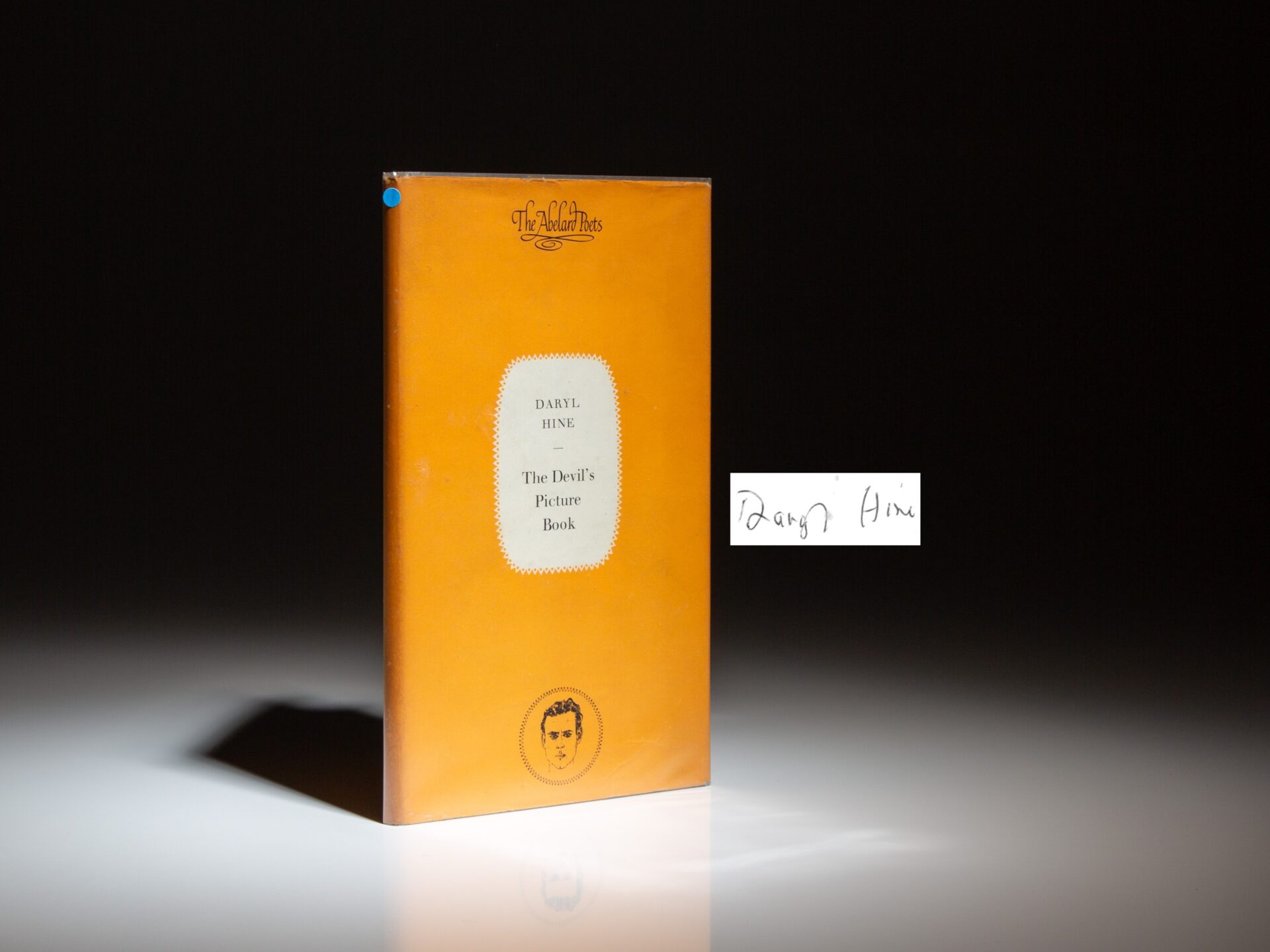 The first edition of The Devil's Picture Book, signed by Daryl Hine.