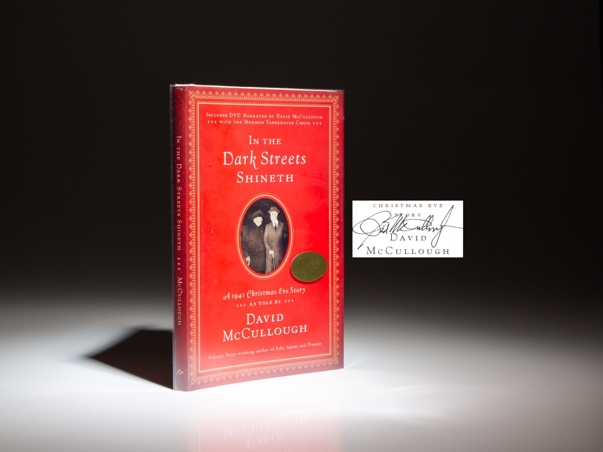 The first edition of In The Dark Streets Shineth: A 1941 Christmas Eve Story, signed by David McCullough.