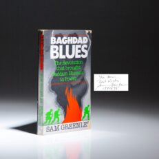 The republication of Baghdad Blues, signed by Sam Greenlee, with the new title "The Revolution that brought Saddam Hussein to Power."