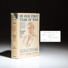 First edition of In Our First Year of War, signed by President Woodrow Wilson in 1918. Includes the publisher's scarce dust jacket.