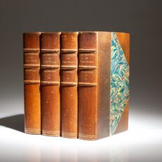 The Daniel Boone Edition of The Winning of the West by Theodore Roosevelt, with a manuscript leaf in Roosevelt's hand.