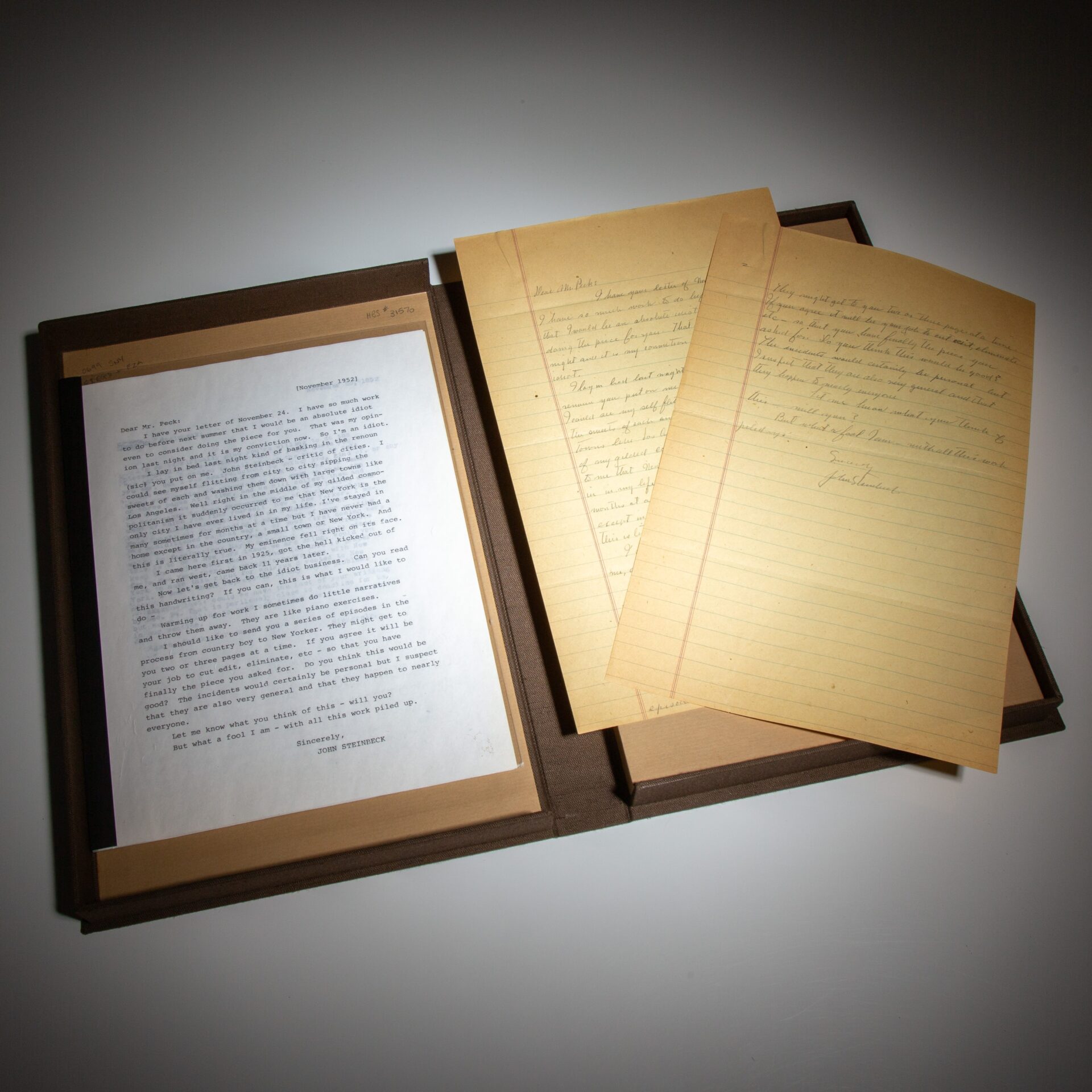 Handwritten by John Steinbeck, parts two and three of his three-part article for The New York Times Magazine titled, "Autobiography: Making of a New Yorker." Together with three autograph letters signed by Steinbeck to NYTM editor Seymour Peck, and one typed response by Peck.