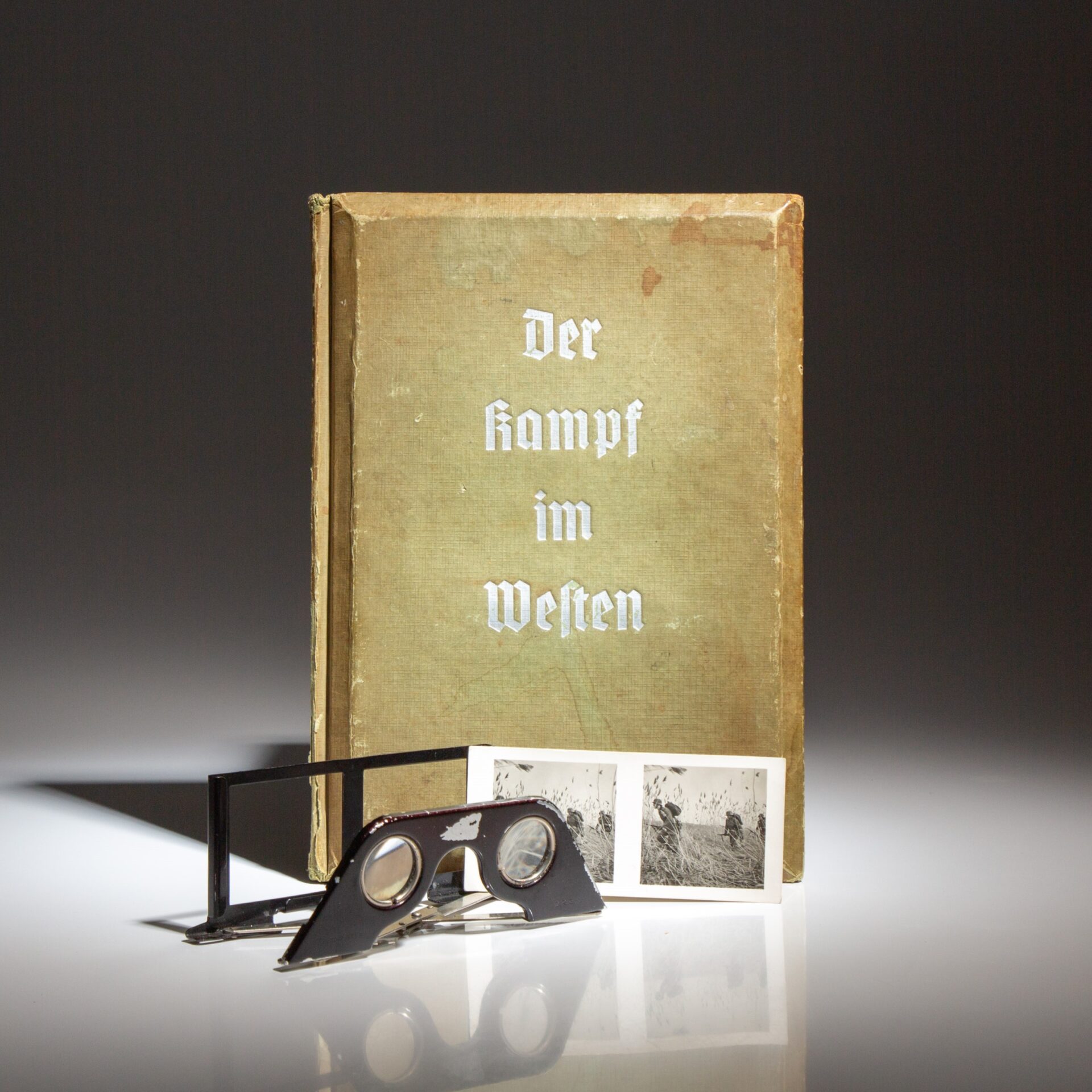 The first edition of Der Kampf im Westen, "The Battle in the West: The Führer's Soldiers in the Field," published in 1940, with 100 stereo view photographs from the battlefield.