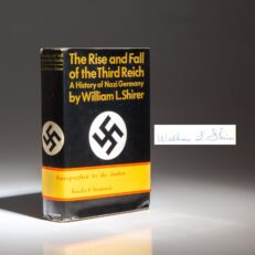 The first edition of The Rise and Fall of the Third Reich, signed by William L. Shirer, with the belly band from Kroch & Brentano's.