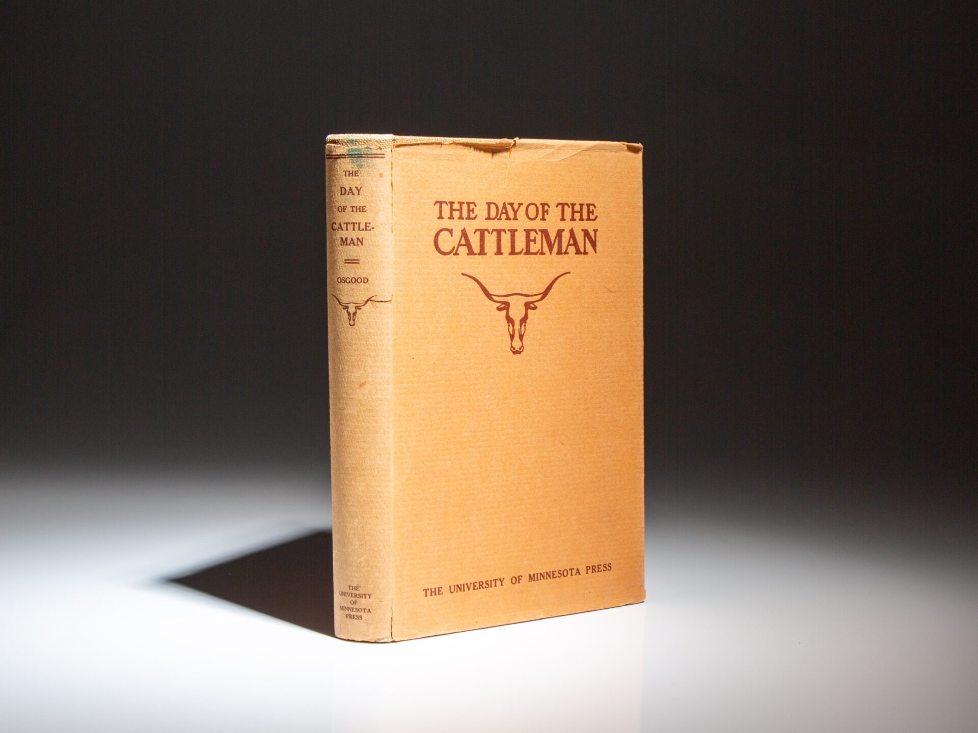 The first edition, first printing of The Day of the Cattleman by Ernest Staples Osgood, in the publisher's scarce dust jacket.