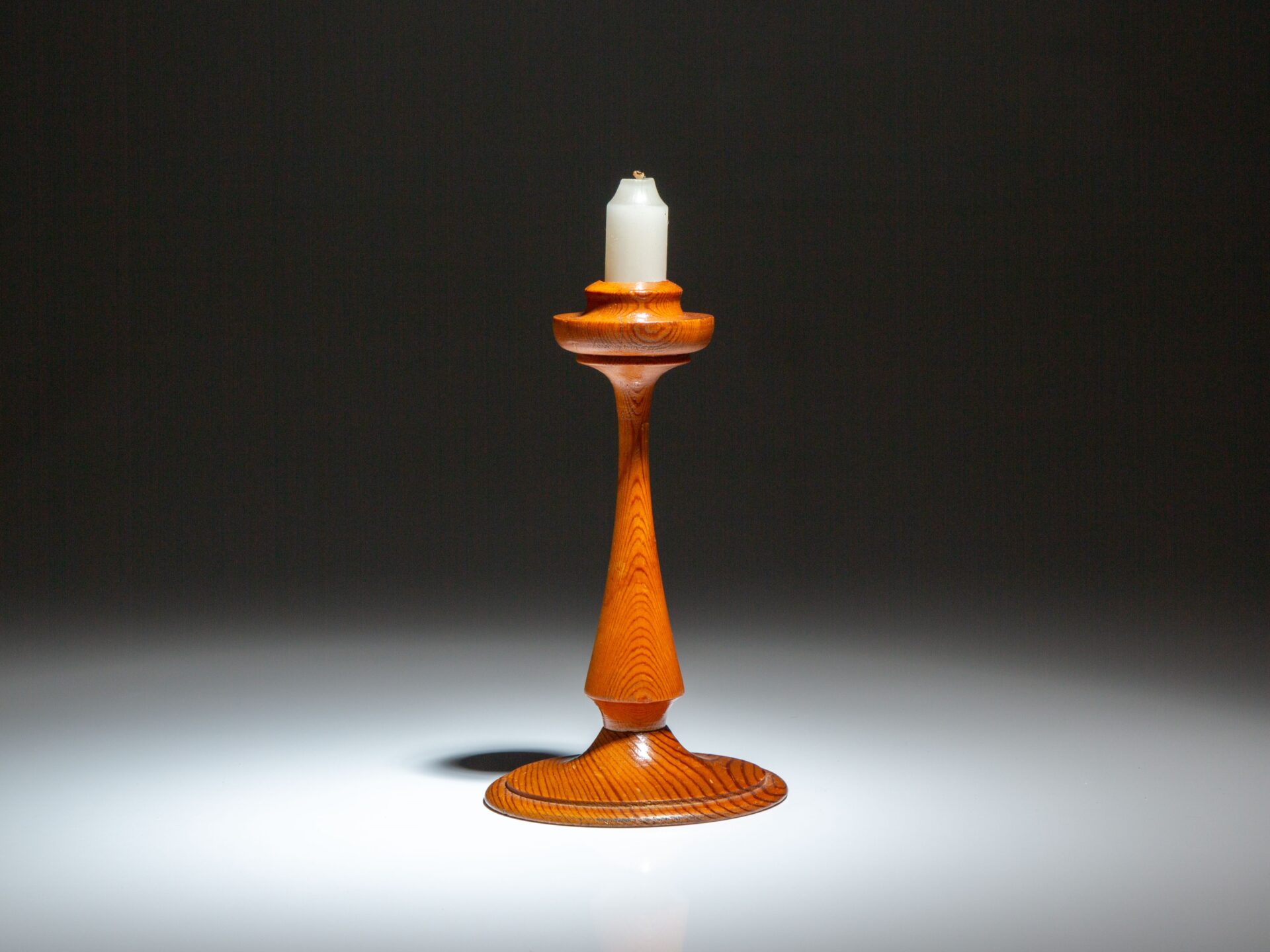 A souvenir candlestick made from longleaf pine removed from the roof of the White House during the 1927 renovation.