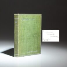 The first edition, fourth printing of Armazindy, inscribed by James Whitcomb Riley with two lines of verse.