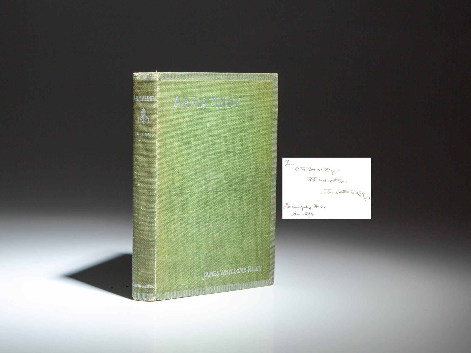 The first edition, fourth printing of Armazindy, inscribed by James Whitcomb Riley with two lines of verse.