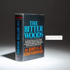 The first edition, first printing of The Bitter Woods, signed by John S. D. Eisenhower.