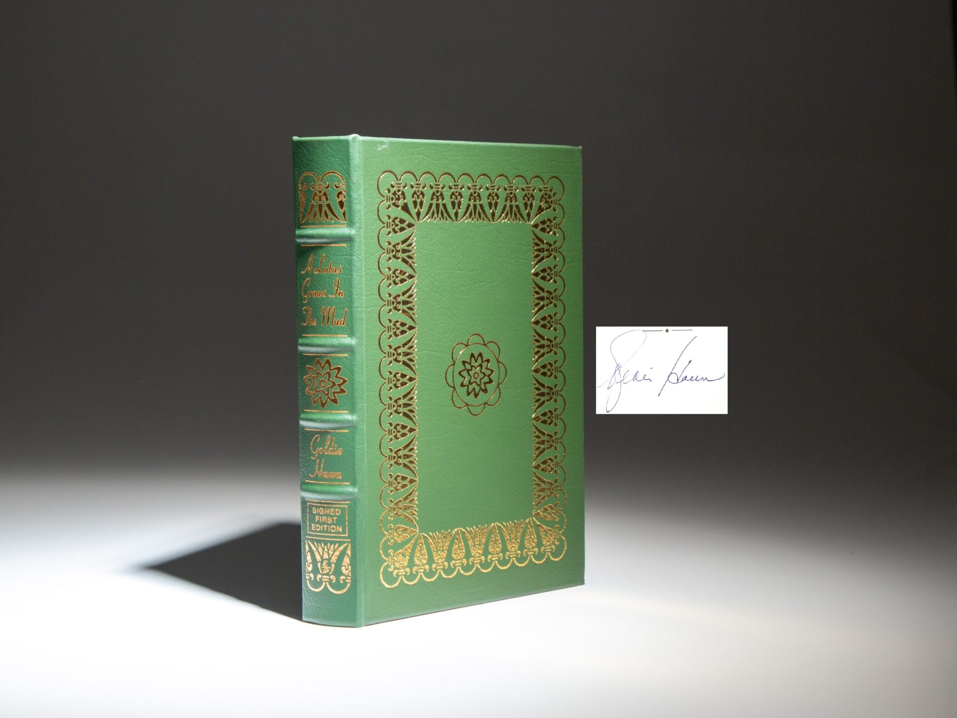 The signed limited first edition, first printing of A Lotus Grows in the Mud by Goldie Hawn.