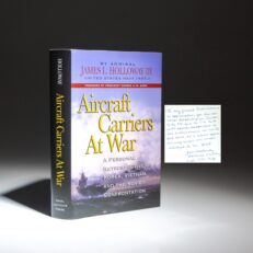 Inscribed to former FBI and CIA Director Bill Webster, the first edition of Aircraft Carriers at War by Admiral James L. Holloway III.